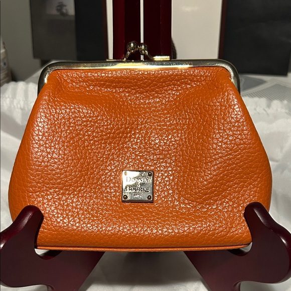 Dooney & Bourke Handbags - Dooney & Bourke Vibrant Orange Pebble Leather kiss lock clutch.